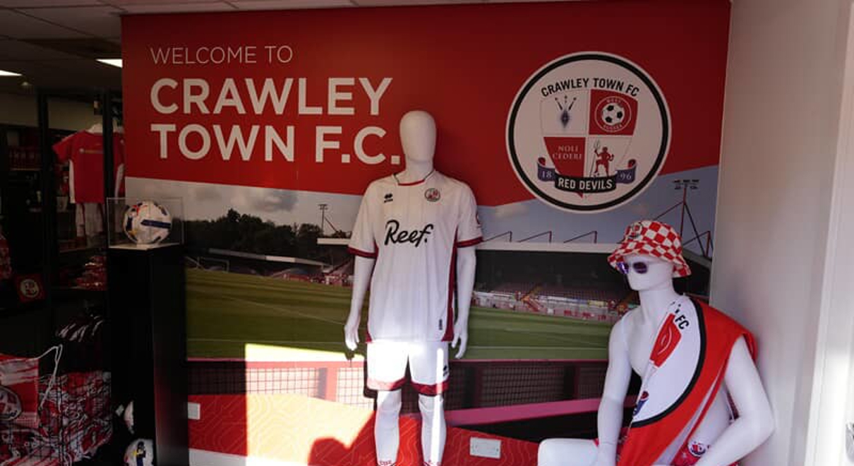 An image of the interior decor and signage for the Crawley Town Football Club.